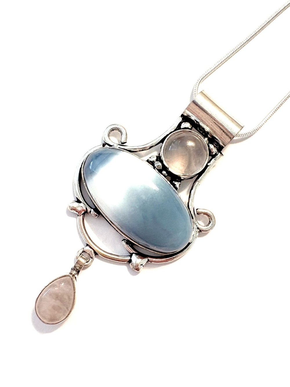 2 1/2 inch, 925 marked, Owhyee Opal  and Rose  Quartz pendant on a silver chain.